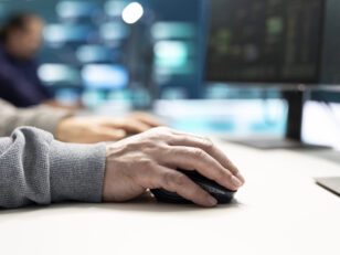 Cyber security experts in governmental hacking room working on securing networks